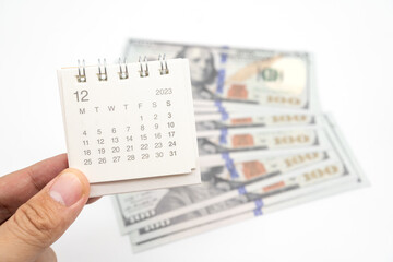 Obraz premium Envelope With Money And Calendar. opens envelope with money, dollars. Pension Concept. Bonus Money. isolated on white background.