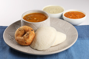 food South Indian food idli vada with sambar on a banana leaf