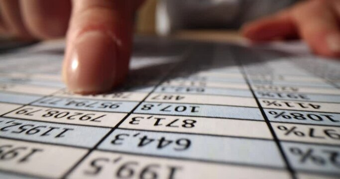 Accountant analyzing business marketing data at office desk