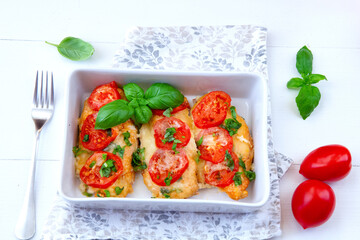 Chicken fillets baked with mozzarella, tomatoes and basil