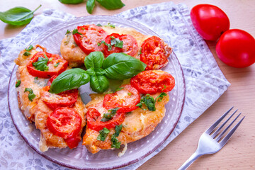 Chicken fillets baked with mozzarella, tomatoes and basil