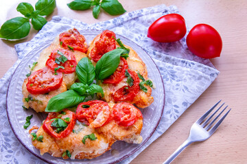 Chicken fillets baked with mozzarella, tomatoes and basil