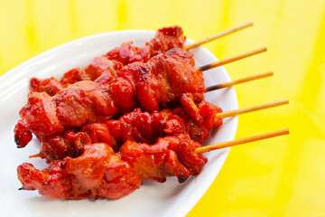 Thai-style grilled chicken. Thai chicken skewers street food