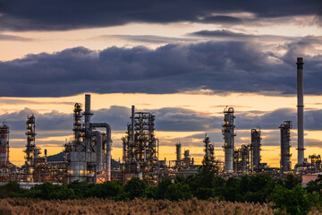 Oil​ refinery​ plant and tower of Petrochemistry industry in oil​ and​ gas​ ​industry with​ cloud​ blue​ ​sky