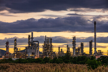 Fototapeta na wymiar Oil​ refinery​ plant and tower of Petrochemistry industry in oil​ and​ gas​ ​industry with​ cloud​ blue​ ​sky