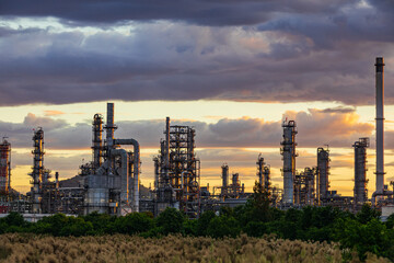 Fototapeta premium Oil​ refinery​ plant and tower of Petrochemistry industry in oil​ and​ gas​ ​industry with​ cloud​ blue​ ​sky