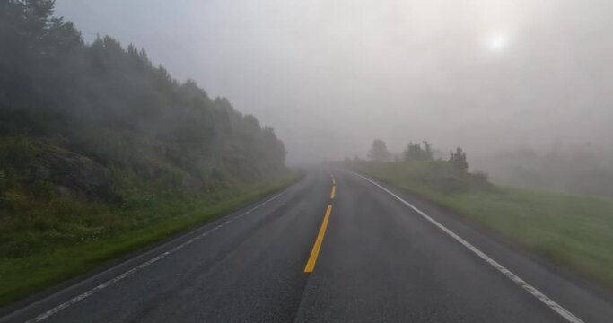 Fog on a Norway road. POV car trip. Vehicle point-of-view Driving a Car on a Road in Norway.