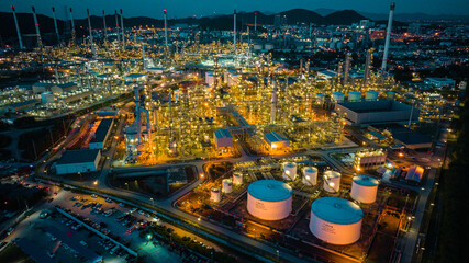 Aerial view of the morning of oil refinery from the drone of tower of Petrochemistry industry in oil​ and​ gas​ ​industry with​ cloud