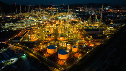Fototapeta na wymiar Aerial view of the morning of oil refinery from the drone of tower of Petrochemistry industry in oil​ and​ gas​ ​industry with​ cloud