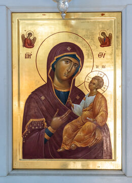 Medieval Madonna holding Jesus as a child portraited on a  golden background