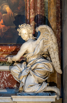 Close-up on ange statue in marble inside catholic church in Italy