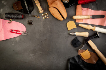Shoe repair shop background. Tools for hand craft, top view