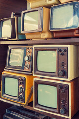 Many retro television. vintage old TV is colorful multi-row. Seeing the past. Pattern wall of old Antique television (TV). Television concept. Media.