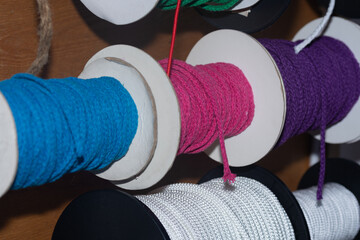 colored cords on spools for creativity