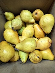 pears on the market, beautiful pears in a box, autumn background