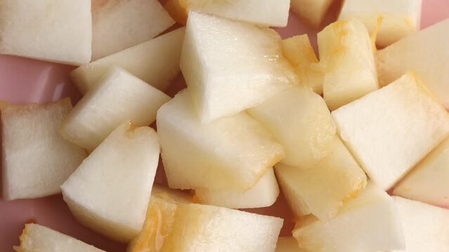 Fresh melon pieces, rotation in circle. slices of ripe juicy melon Turning. selective focus.	
