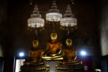 Ancient buddha statue in antique old ubosot for thai people traveler travel visit respect praying...