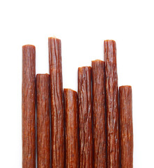 Smoked thin sausages, isolated on white