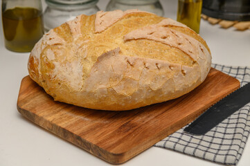 freshly baked homemade bread on the kitchen table on a light background 3