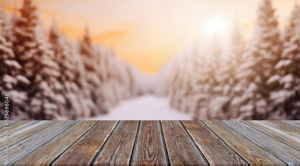 Aufkleber wooden table in front of blurred winter forest background with sunlight. high quality photo