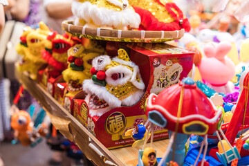 Fototapeta na wymiar People visit and buy colorful traditional lanterns hanging on Luong Nhu Hoc Street in Vietnam