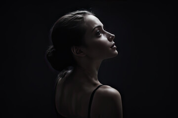 Woman looking sideways stock image. black dark background