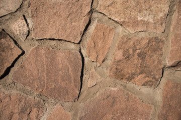 rocky stone wall red background texture