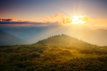 Naklejka premium A breathtaking view of the mountain ranges lit by the sun. Carpathian mountains, Ukraine, Europe.