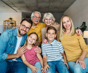child family portrait woman mother man father grandmother daughter group smiling happy adult girl...