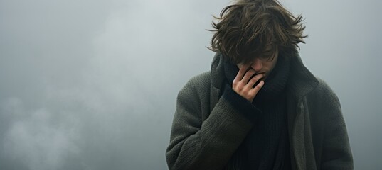 Depression, addiction, and mental health young man lost in a misty cloud with text space. - obrazy, fototapety, plakaty