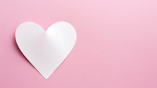  a white heart cut out of paper on a pink background with a place for a text or an image of a paper heart on a pink background.