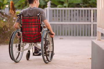 A young man with disabilities in relax time on beauty nature background,Lifestyle with disability...