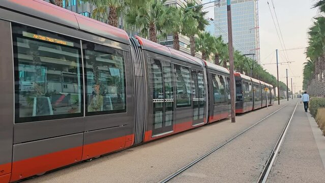 Casablanca, Morocco - 23 November 2023  - Casablanca Tram way passing against modern  building in Casablanca Finance City or CFC 