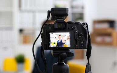 Male in suit and tie show confirm sign arm making promo videoblog or photo session in office...