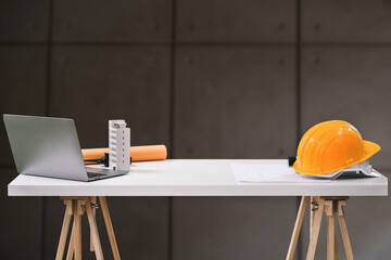Construction house and building. Profession concept with architect desk and tools on a wooden table.