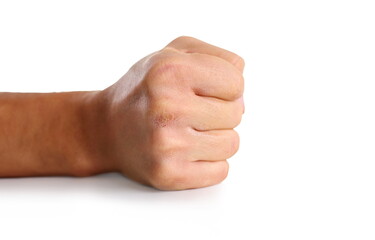 Male clenched fist isolated on white background closeup. Aggressive angry strong riot for freedom...