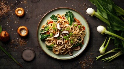 Asian vegetarian food udon noodles with baby bok choy, shiitake mushrooms, sesame and pepper close-up on a plate on the table. horizontal top view from above - obrazy, fototapety, plakaty