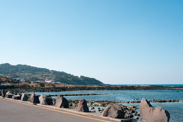Fototapeta na wymiar Seaside road in Jeju Island, Korea