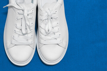 white sneakers,  background. sport shoes,   Lifestyle sneaker sport shoe. Stylish white sneaker.