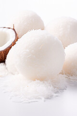 Coconut balls dessert with coconut flakes. Generative AI,