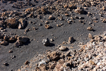 Black volcanic sand and stones in Tenerife, Canary Islands, Spain