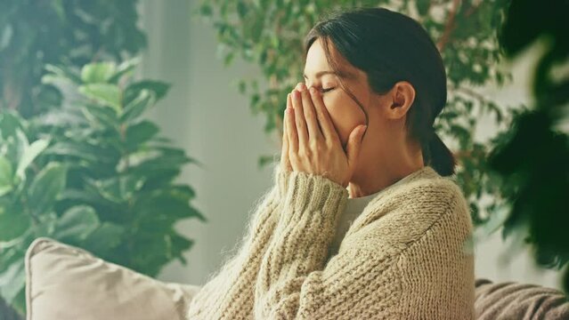 Young beautiful smiling yawn woman. Raising arms stretching back muscles, yawns, enjoying carefree peaceful weekend relaxation time alone in living room. Relax, calm, rest, peace, happiness