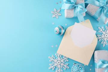 Write your wish list to Santa Claus. Top view flat lay of envelope with card, frosty fir twigs,...