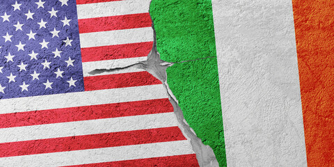 USA and Ireland flags on a stone wall with a crack, illustration of the concept of a global crisis...