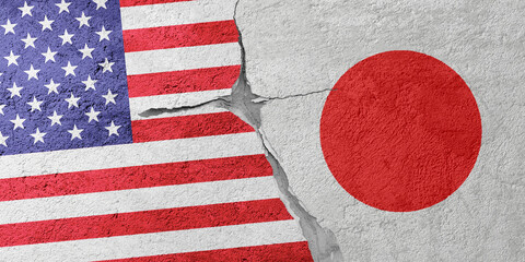 USA and Japan flags on a stone wall with a crack, illustration of the concept of a global crisis in...