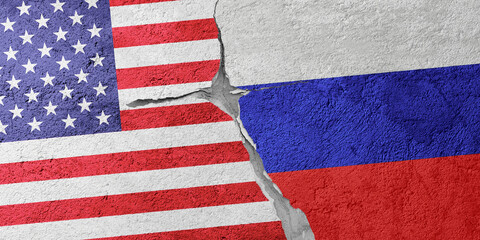 USA and Russia flags on a stone wall with a crack, illustration of the concept of a global crisis in political and economic relations