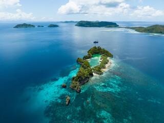 Idyllic Rufas Island, near Penemu in Raja Ampat, is surrounded by healthy corals and open ocean....