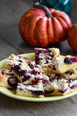 delicious homemade PLUM pie with berries on a table