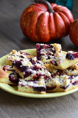 delicious homemade PLUM pie with berries on a table