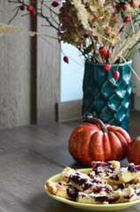 delicious homemade PLUM pie with berries on a table